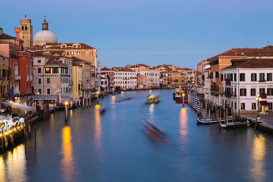 Night falls on Venice. The boats are bustling, the lights shine like stars, and I stand on the bridge waiting for a long exposure… Kind of lovely to sit back and watch :) (at Ponte dell'Accademia)