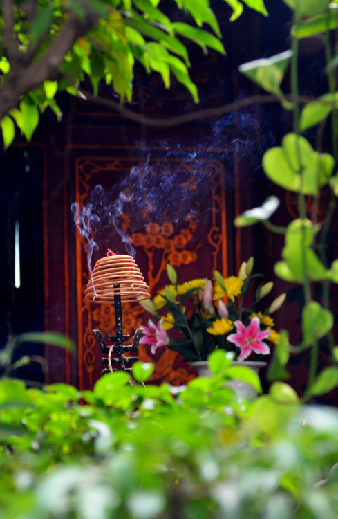 Smoke rises from incense at Quan Thanh Temple established during the reign of Emperor Lý Thái Tổ (re