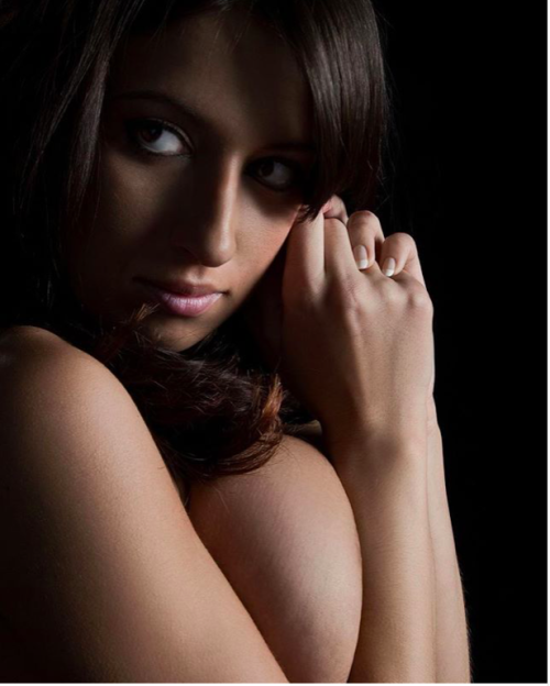 Jana Defi shines in the shadows. adult photos