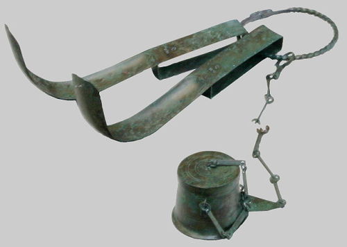 Ancient Roman bathing tools: two strigils and an olive oil flask. To clean the body during bathing, 