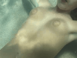 Women Blowing Bubbles Underwater