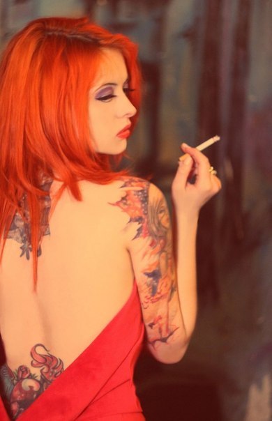 wanda-coxxx: Mmm! Crazy mad red hair luv, she’s got it all working!!! The tattoos and cigarettes…sin
