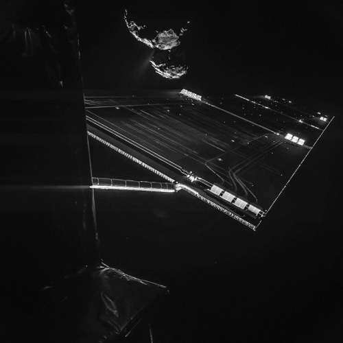 Comet 67P/C-G Is Framed By One Of Rosetta’s Solar Wings, Which Is 46 Feet Long. A Stream Of Gas And