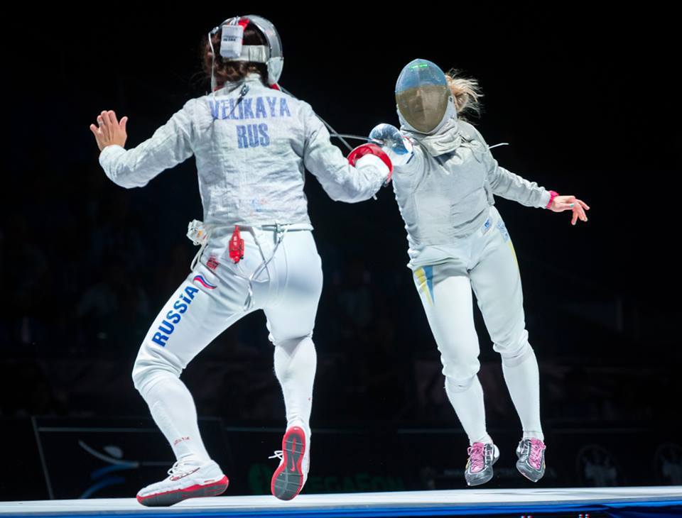 modernfencing:  [ID: a sabre fencer flunging at her opponent.] Sofiya Velikaya (left)