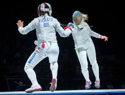 Modernfencing:  [Id: A Sabre Fencer Flunging At Her Opponent.] Sofiya Velikaya (Left)