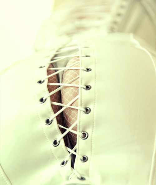 discreetdreams:Latex skirt and fishnet pantyhose