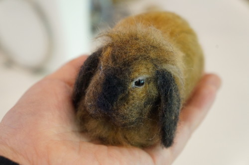 janetsneedlefelting:A lop eared bunny replica (real pet in inset). 4 inches long, made of wool.