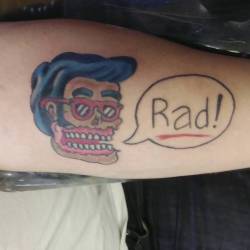 A recent tattoo of a rad zombie skull.  