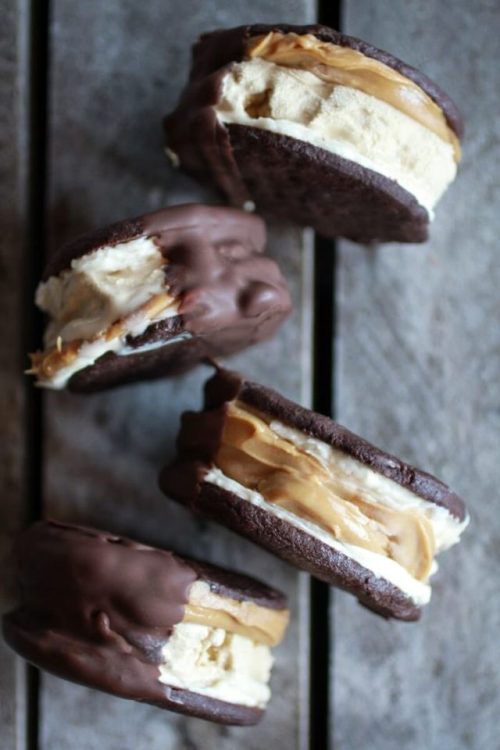 sweetoothgirl:chocolate dipped homemade peanut butter oreo mocha ice cream sandwiches