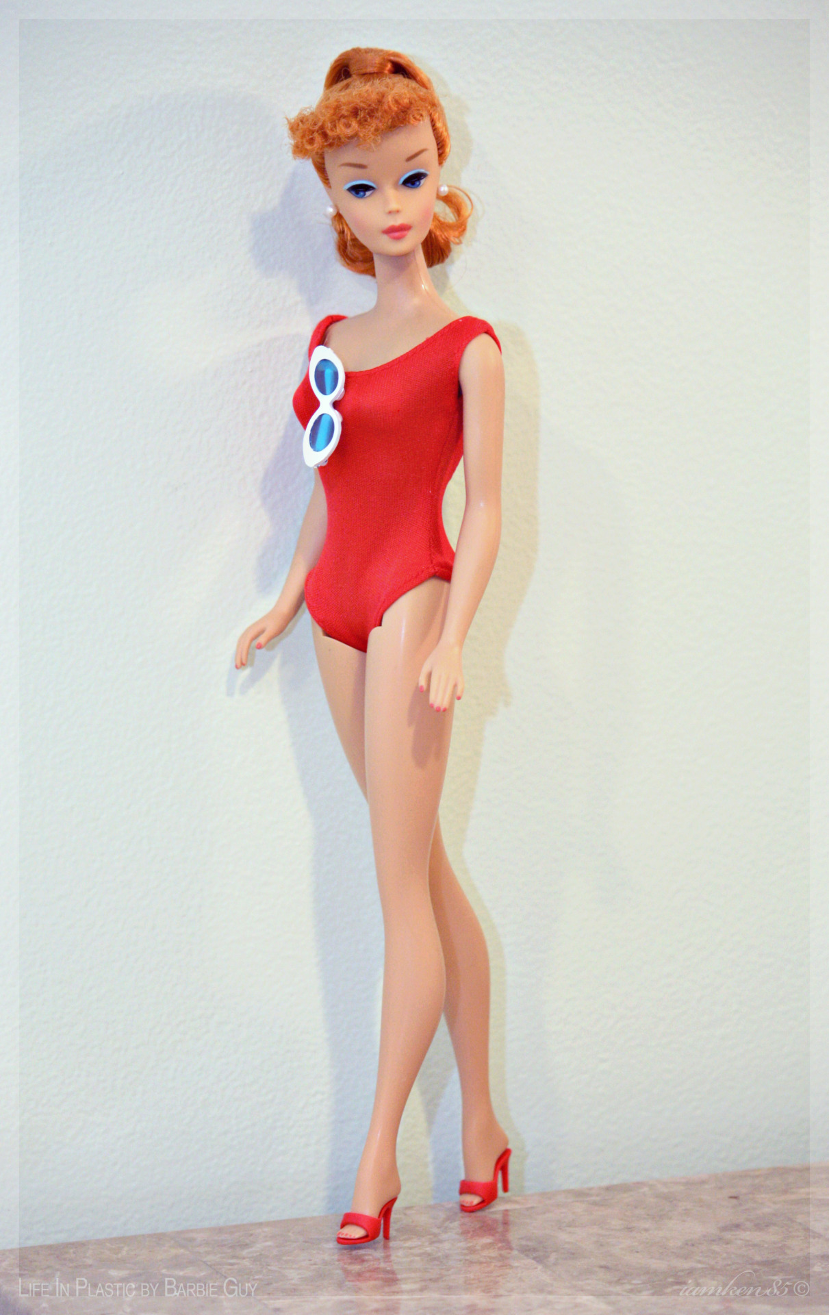 Let’s Play Barbie doll. The latest doll to join my personal collection is this redhead vintage reproduction swirl ponytail Barbie doll wearing a red helenca swimsuit and matching heels, recreated by designer Bill Greening. She came in a box that was...