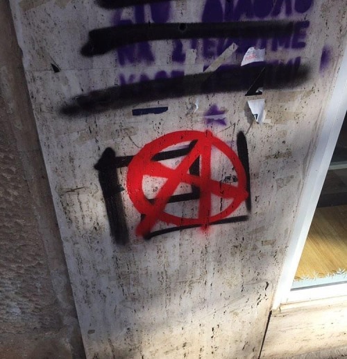 Anarchist tag covering a fascist ‘Golden Dawn’ logo in Athens, Greece