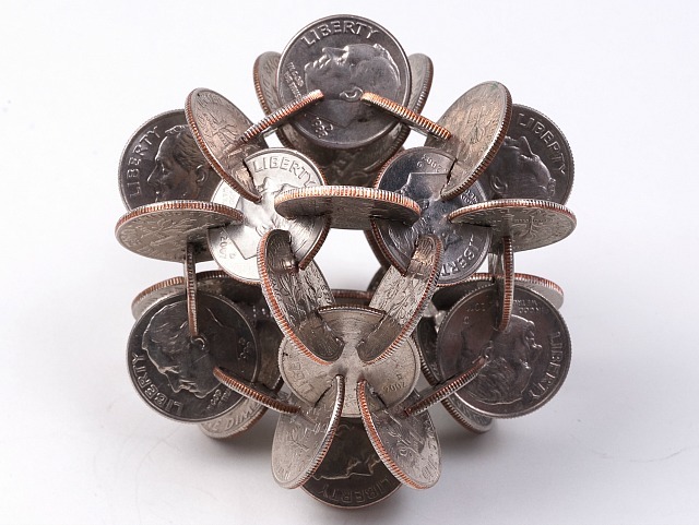 junkculture:  Complex Geometric Forms Made from Coins Notched and Joined Together