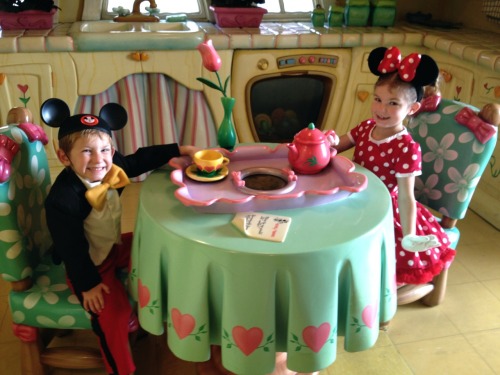 Mickey and Minnie sharing a high tea in Minnie&rsquo;s house.