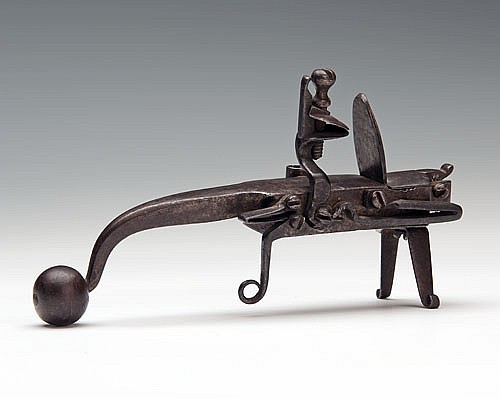 An 18th century flintlock tinderlighter.