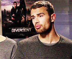 divergents:  Theo James + playing with his shirt 