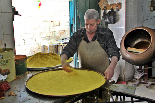 A baker in the West Bank city of Nablus prepares the well-known local specialty of Nabulsi kenafeh. 