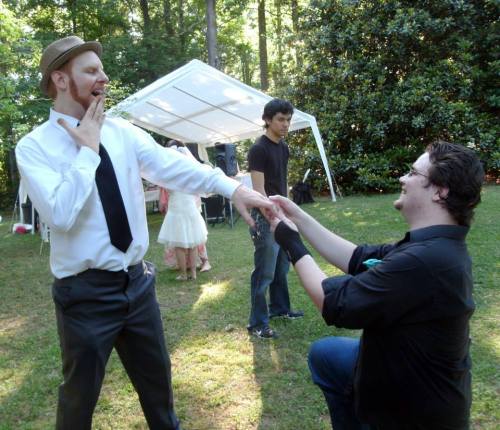 Our friend Ashton proposing to my husband while a jealous Evan looks over in utter disappointment