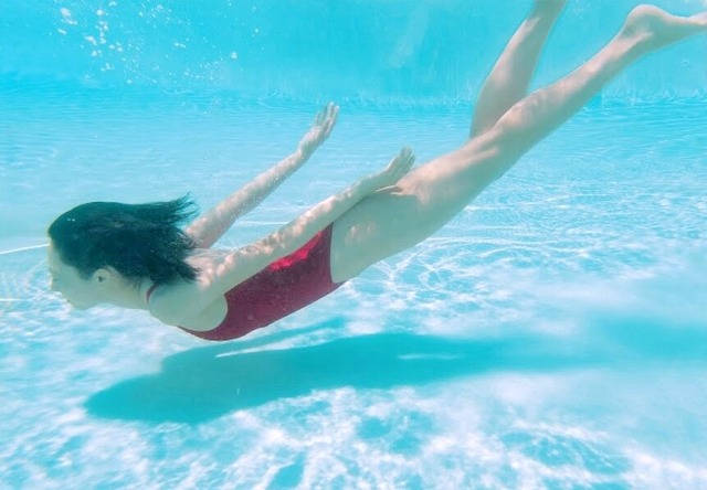 Who is this beautiful girl swimming?