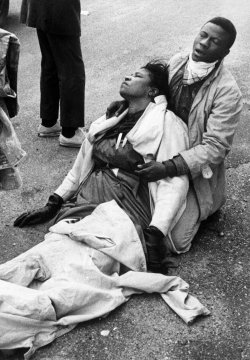 historicaltimes:  Amelia Boynton Robinson has died today at 104. In this photo she is with a fellow marcher in 1965 after being knocked unconscious by Alabama troopers at the Edmund Pettus Bridge in Selma. She was played by Lorraine Toussaint in the film