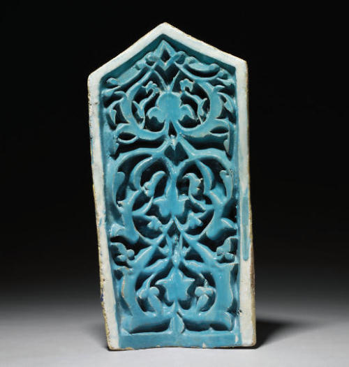 A Timurid carved pottery niche tile, Central Asia, 1380This tile is possibly from the &ldquo;Mausole