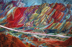 vvolare:  Rainbow Mountains in Zhangye Danxia Landform Geological Park, China. The “rainbow” effect is achieved through different colored sandstones and minerals being pressed together for over 24 million years and then buckled up by tectonic plates.