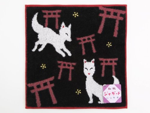 Fluffy handtowel depicting Inari shrine foxes (seen on)