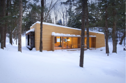 mymodernmet:  Nestled deep in the Quebec forest, La Luge is a vacation home that allows visitors to live directly amid the wonders of nature. Created by yh2 architects, the home was constructed out of cedar, oak, and walnut, with the darker and lighter