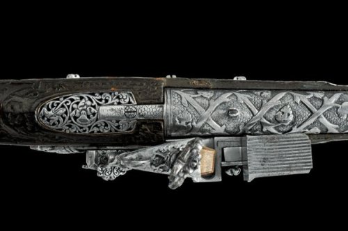 An ornately engraved and chisled miquelet petronel originating from Naples, late 17th century.
