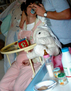 babiedforever:  This baby girl canâ€™t believe her luck. Her half-closed eyes and docile posture make her elation immediately clear - and what else could you possibly expect?Â Sat in her highchair and clad in soft pink dungarees and thick diaper,Â she