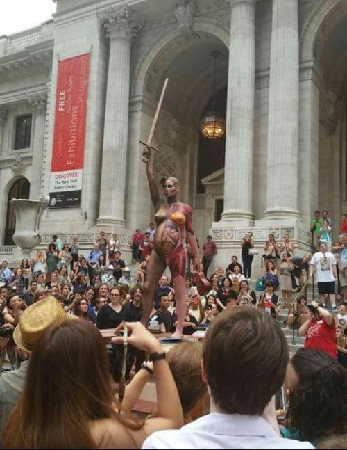 perceval23:   Amanda Palmer as a statue for a children’s book benefit at the New York Public Library.  And here’s David Hirst’s Verity, that she’s recreating. 