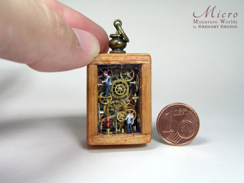 Miniature factory pendant with tiny little workers, closed inside wooden frame box and sealed with g