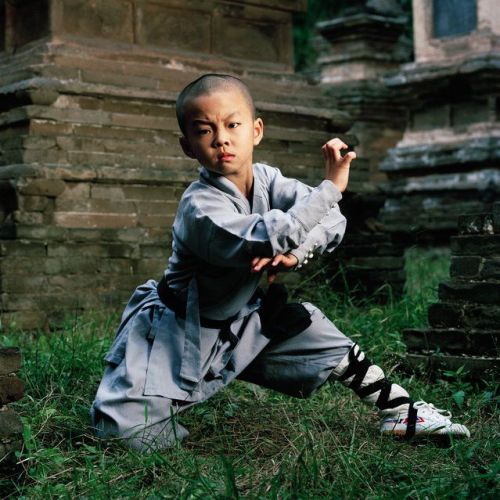 taichi-kungfu-show:  Young kid practicing Shaolin kung fu.    We offer you first-rate tai chi swords on: http://www.icnbuys.com/tai-chi-swords    