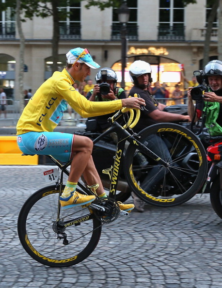 kuatdriveyards:  fuckyeahcycling:  PARIS, FRANCE - JULY 27: Vincenzo Nibali of Italy and Astana Pro Team performs a wheelie to celebrate his victory following the twenty first stage of the 2014 Tour de France, a 138km stage from Evry into the Champs-Elyse