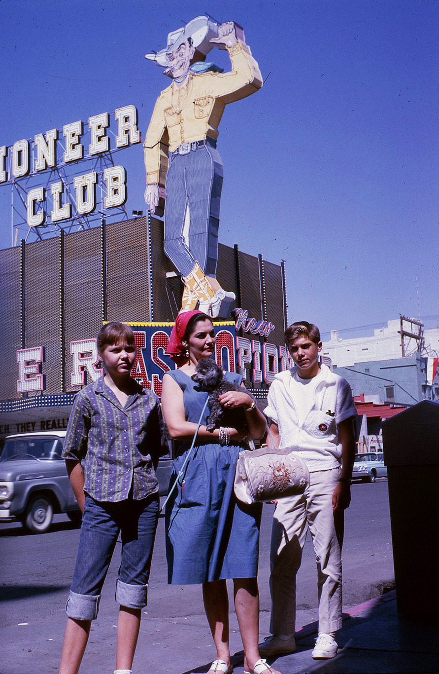 Fremont & 1st, Las Vegas, 1962. Mom, poodle, two boomers, and Vegas Vic. Background on the right, Club Bingo under construction.