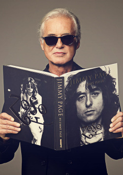 givemepage:  Jimmy Page holding his photobiography,