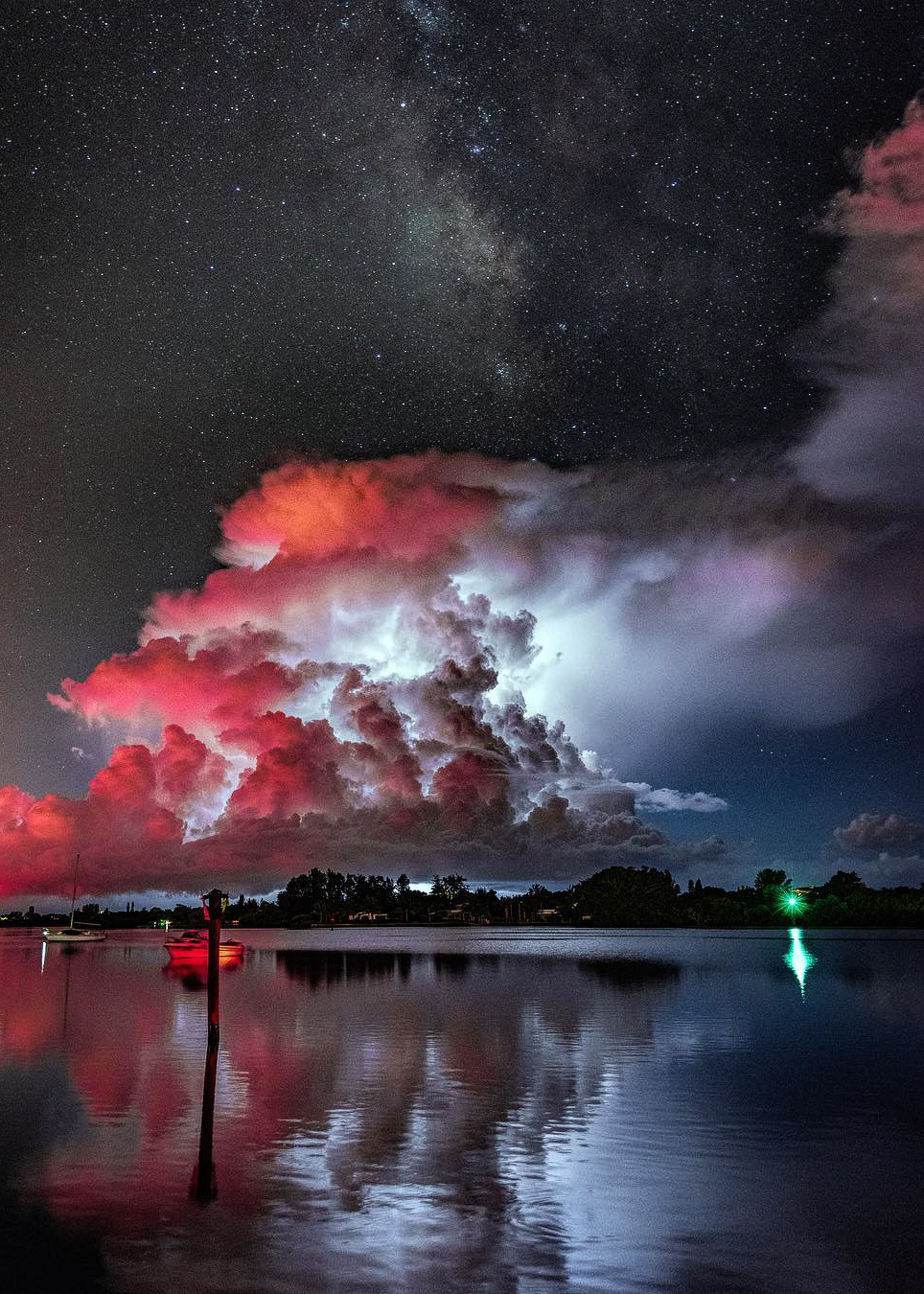 coiour-my-world:“Only in Florida, lightning and milky way together.” | Osprey