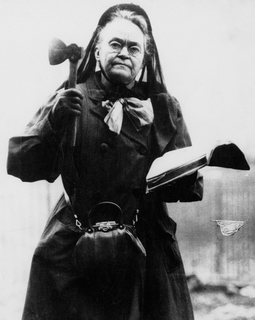 The lovely Carrie Nation poses with her bible and hatchet. A bible thumpin’ granny form Kansas