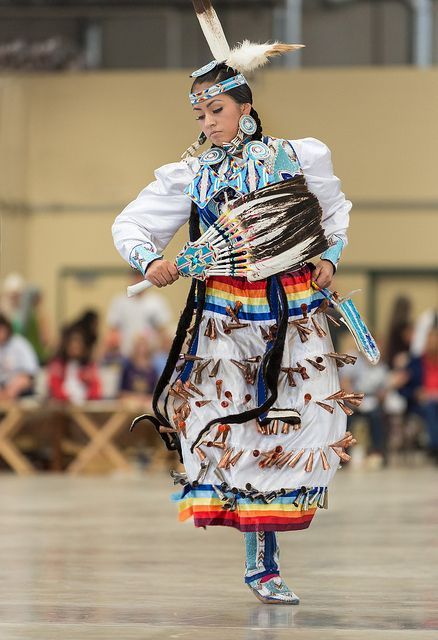 Native American dancers. Jingle Dress is a Native American Powwow dance performed by women. The rega