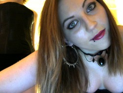 Mistressbri wearing bright red lipstick and spiked hoops- she means business tonight!
