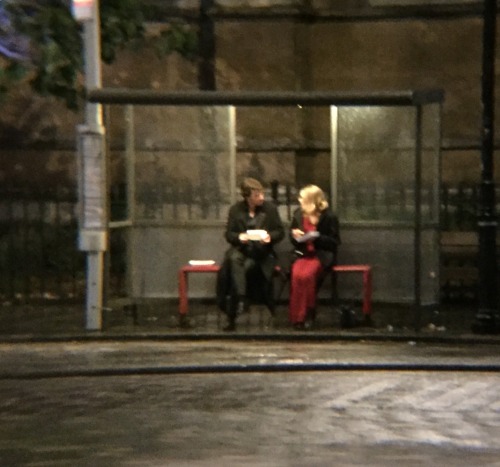 constancecream:Sherlock and the woman in red inside the bus stop.Eating fish and chips, talking, dis