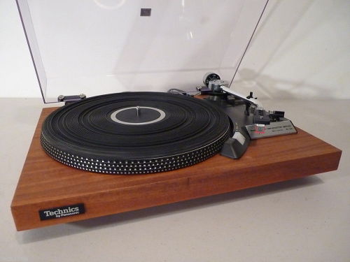 Technics SL-23 - Restored One Of A Kind Auto Return Turntable.   A true classic one of a kind turntable by Technics, model SL-23. The turntable has been restored to better than original condition. The base had the gray vinyl covering removed and real