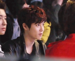  suho is talking cutely by himself ..  
