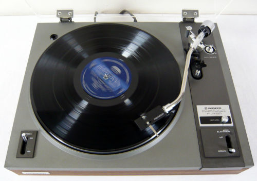 Pioneer PL-115 | Auto Return Belt DriveTurntable. Reconditioned and serviced. Semi automatic. Original vinyl removed and replaced with real wood walnut veneer. Mechanism cleaned and lubricated. The dust cover has been buffed and polished. Sure Hi Track