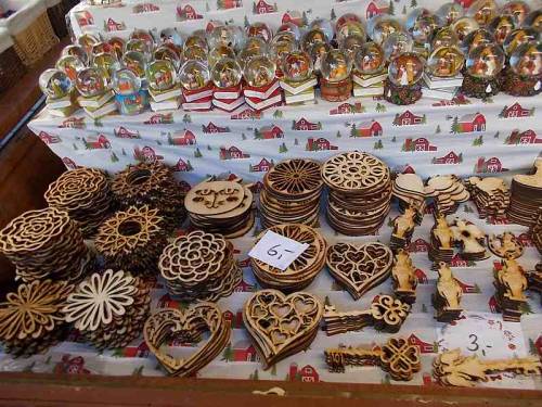 Interesting merchandise made of wood. Christmas market offer in the city Wroclaw, Poland.