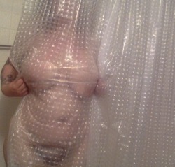 Cosmogirlxxx playing peekaboo with the shower curtain