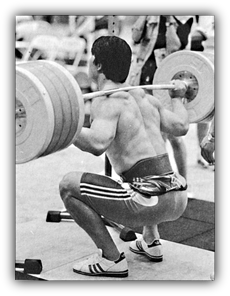 Pushing your knees forward in the Squat.