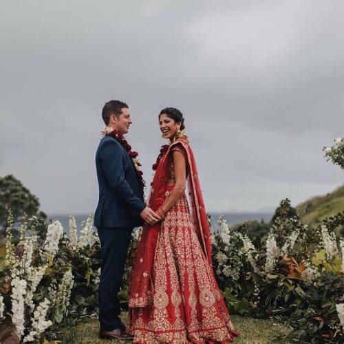 Stunning fusion couple. @shyamalbhumika bride Aarti in her wedding lehnga makes a memorable photo wi