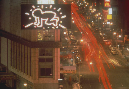 twixnmix: Keith Haring’s in front the Spectacolor Billboard showcasing his signature Radiant B