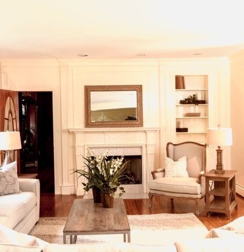 Living Room Library In BostonWith Beige Walls, A Standard Fireplace, And A Wood Fireplace Surround, This