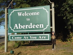 eileen-confusion:  Today I was in Aberdeen WA, where Kurt Cobain was born and lived.  Here’s the Memorial Park dedicated to him, right under the bridge on Wishka river.  The park is very small, nothing pretencious, just two benches and a couple of plates…